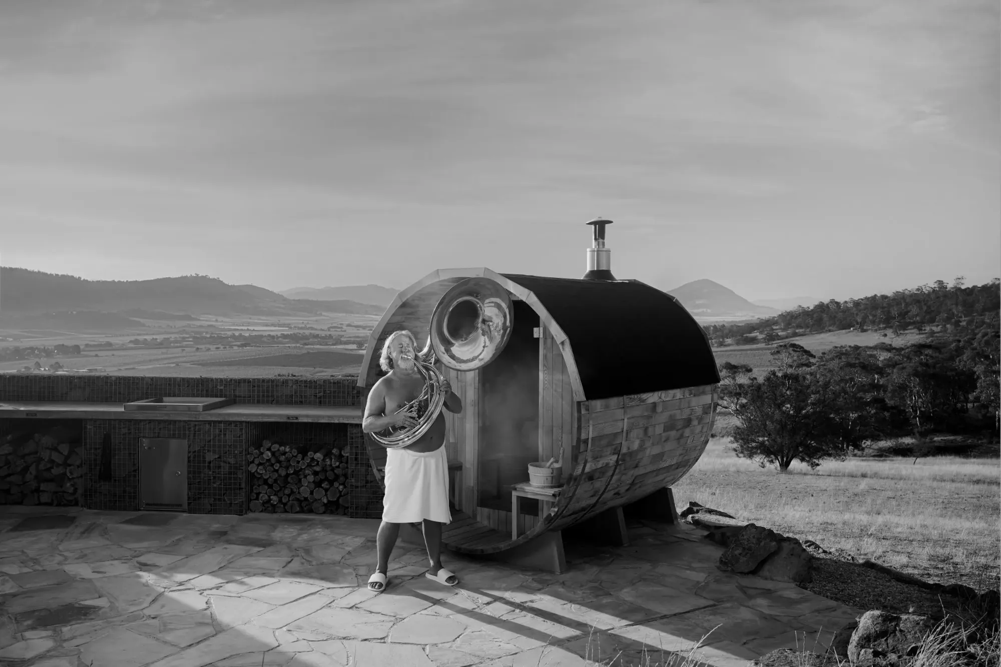 Tourism Tasmania Off Season — a barrel sauna and tuba in the Tasmanian hills